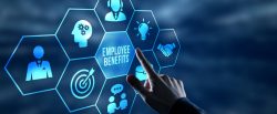 A person taps a huge digital button that says 'employee benefits'