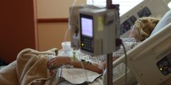 A woman lying in a hospital bed