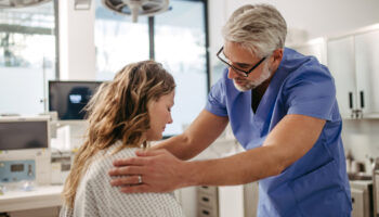 doctor in an emergency room treating a patient