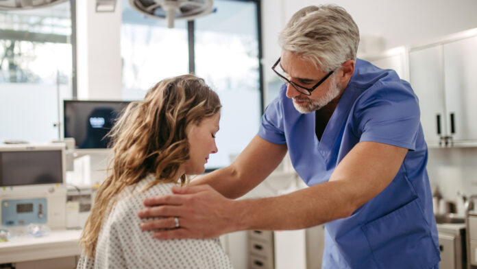 doctor in an emergency room treating a patient