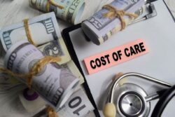 Rolls of dollar bills along with a piece of paper labelled 'cost of care'. Learn more about how to cover what insurance doesn't pay for in rehab, here.