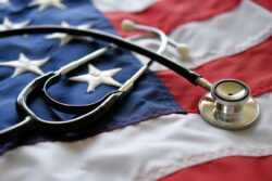 A stethoscope rests on an American flag. Learn more about tricare coverage for drug and alcohol rehab here.
